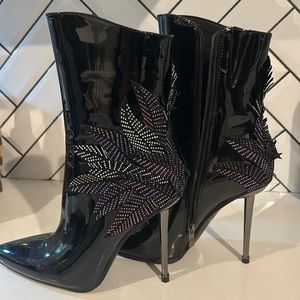 AKIRA Black Patent Heeled Boots with Rhinestone Leaf Design